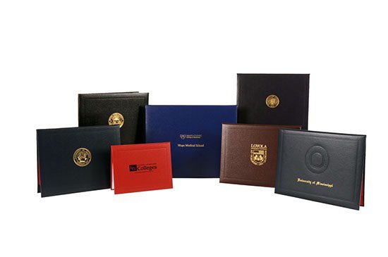 A group of six different colored books with the same logo.