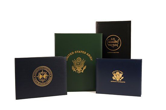 A group of five different books with the seal of the united states army on them.