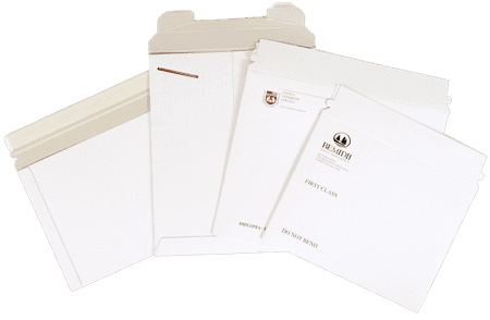 A group of white envelopes sitting on top of each other.