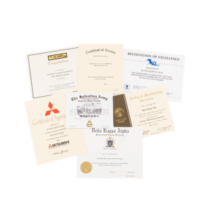 A pile of certificates on top of each other.