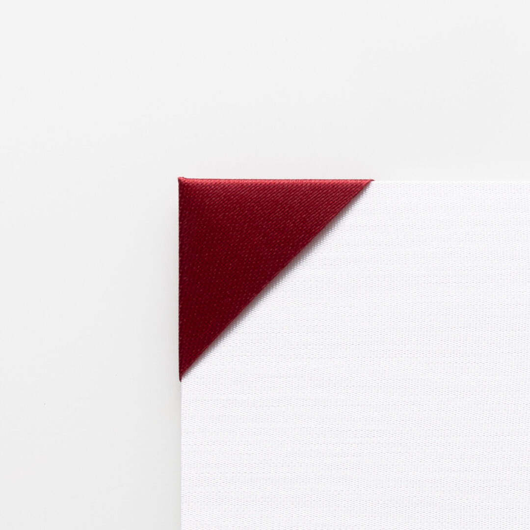 Close-up of a maroon canvas